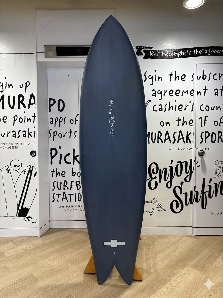Blue surfboard on a wooden stand displayed upright in a shop, with bold wall art and text behind it.