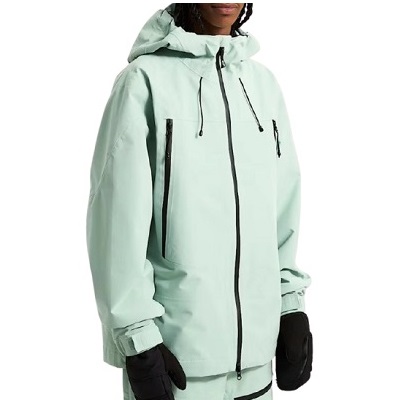 Mint green hooded ski jacket with black zippers and pockets worn by a person with gloves inside a white background.