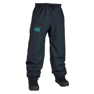 Dark navy windbreaker pants with elastic waistband and cuffs, logo on the left thigh, paired with black boots.