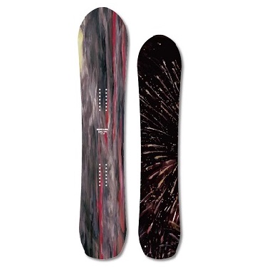 Pair of skis standing upright; left ski has colorful abstract stripes, right ski is black with a starburst pattern.