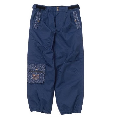 Navy blue cargo pants with patterned fabric patches on the pockets and left knee, with a belt at the waist.