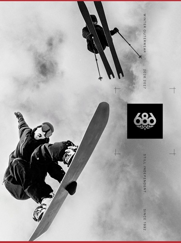 Black-and-white magazine cover showing a snowboarder mid-air with skis overhead, red borders at top and bottom, and a logo block on the right side.