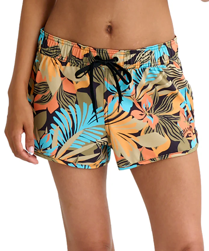Women's tropical print swim shorts with a black drawstring waist tie on a model, featuring orange, teal, and beige leaves.