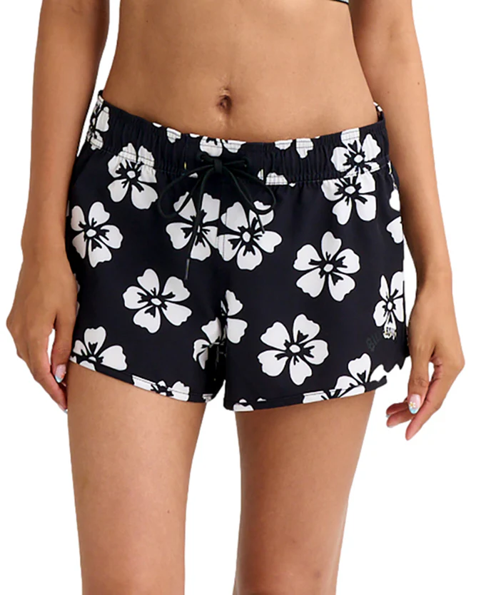 Black swim shorts with a white hibiscus floral pattern and a drawstring at the waist.