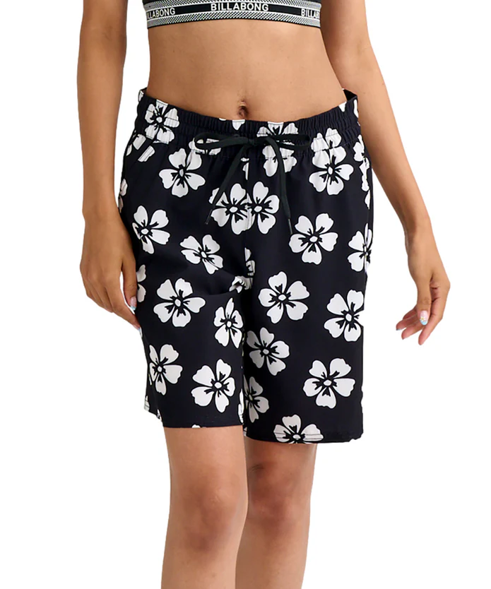 Black board shorts with a white hibiscus floral print and a drawstring waist.