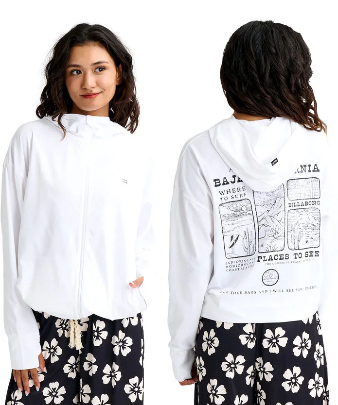 Front view: a woman wearing a white hooded zip jacket with pockets, paired with black pants featuring white hibiscus flowers; minimal logo on chest visible. Back view: the same jacket shown from behind, with a large graphic print on the back and the hood down. Pants show the matching floral pattern across both poses.