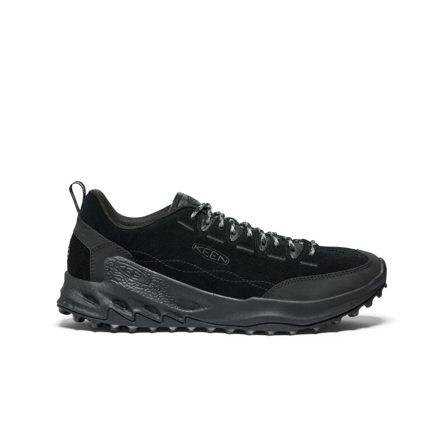 Black KEEN hiking shoe shown in side view with rugged outsole on a white background