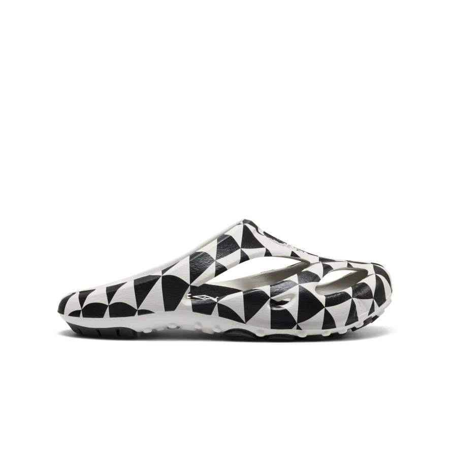 Side view of a white slip-on shoe with a black geometric triangular pattern.