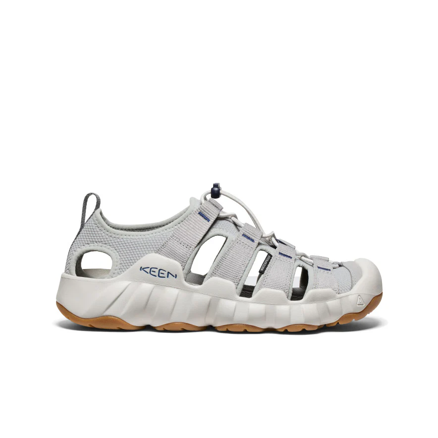Gray KEEN outdoor sandal with open-toe design, multiple straps, and a chunky white midsole on a tan outsole.