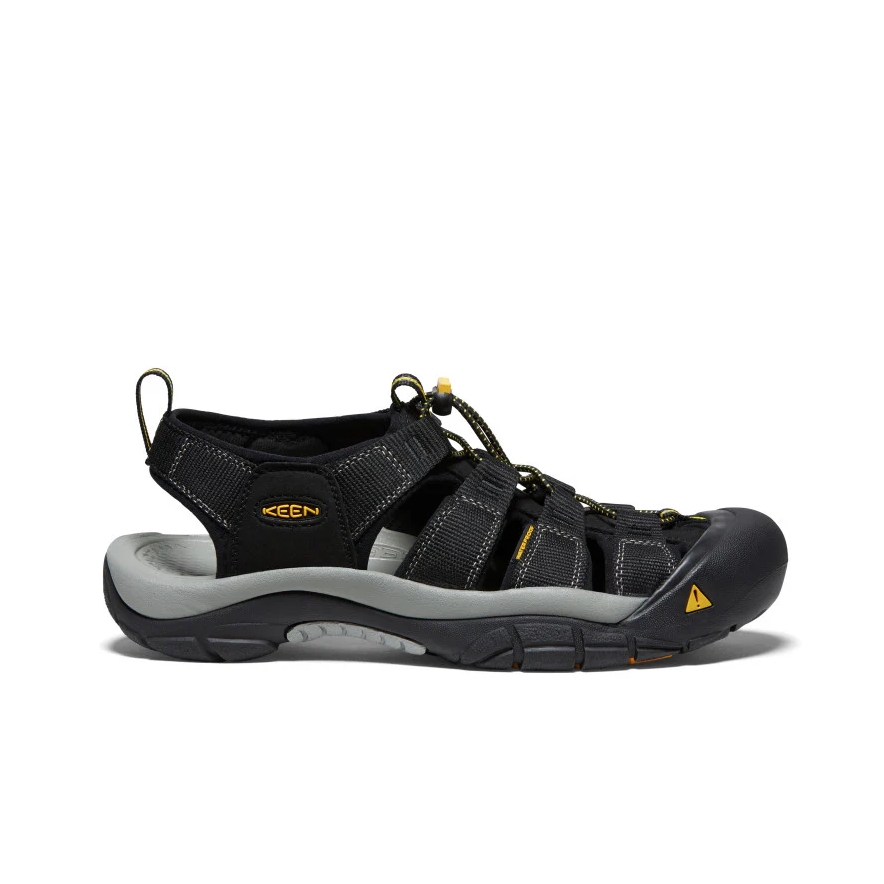 Black KEEN outdoor sandal with closed toe, multiple strappy fastenings, and rugged gray sole; yellow logo accents emphasize outdoor design.