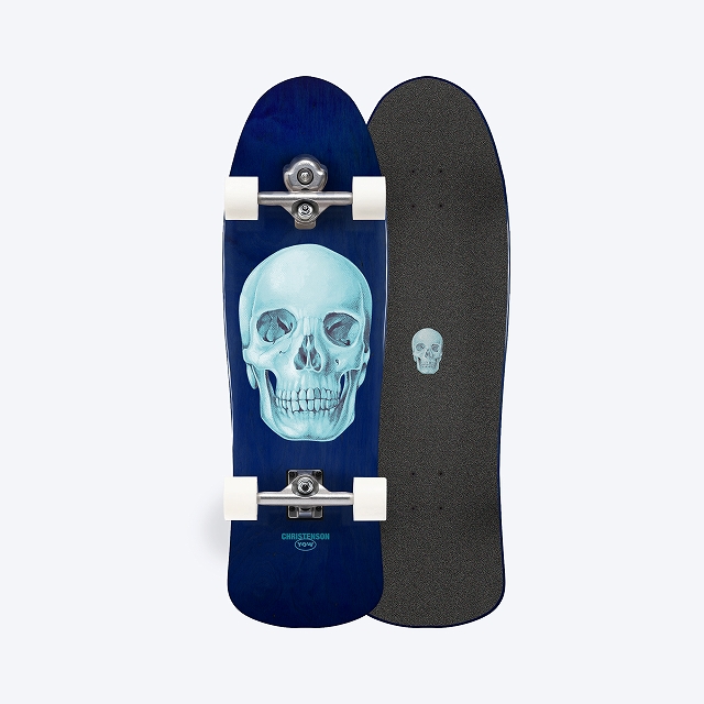Pair of skateboards: a blue longboard with a turquoise skull graphic and white wheels/trucks beside a plain black grip-taped board.
