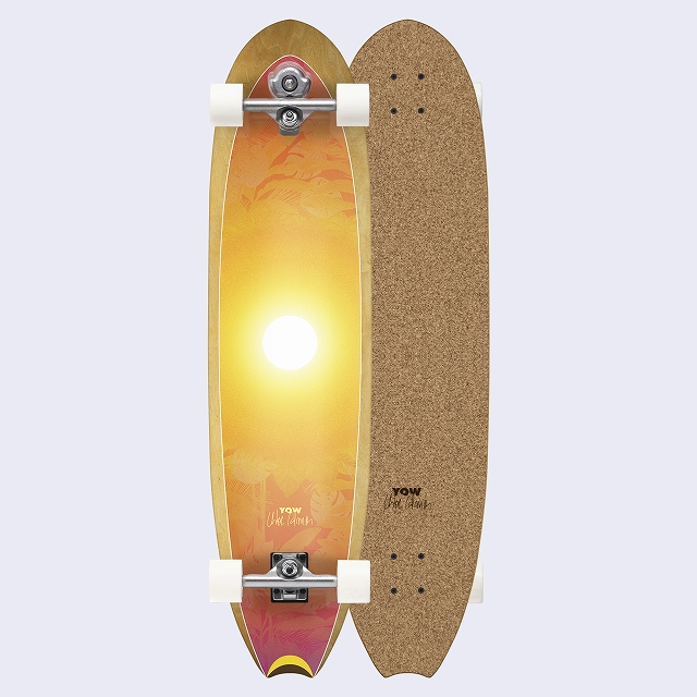 Two longboards shown lengthwise: left board with a yellow-orange sunset graphic; right board with cork finish.