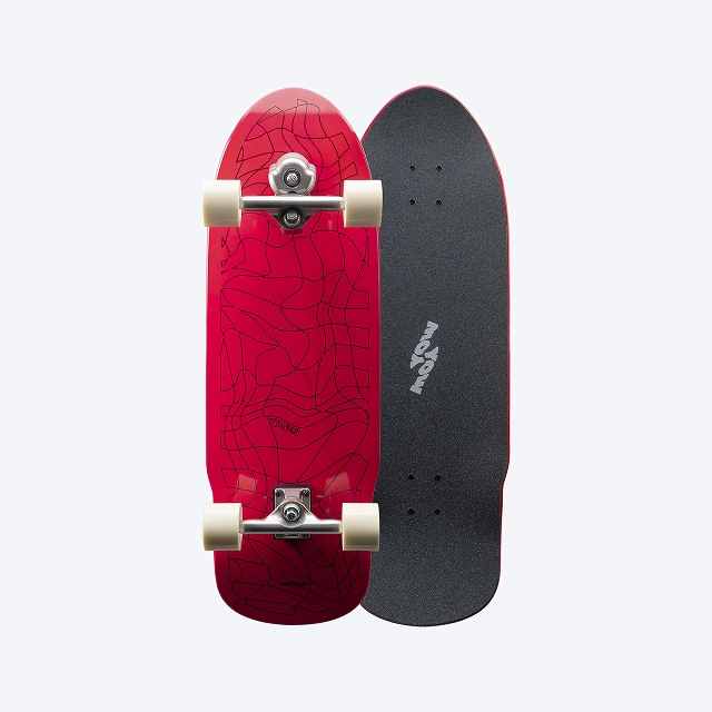 Two skateboards shown side by side: a red deck with a geometric line-art pattern and cream wheels, and a black deck with grip tape.