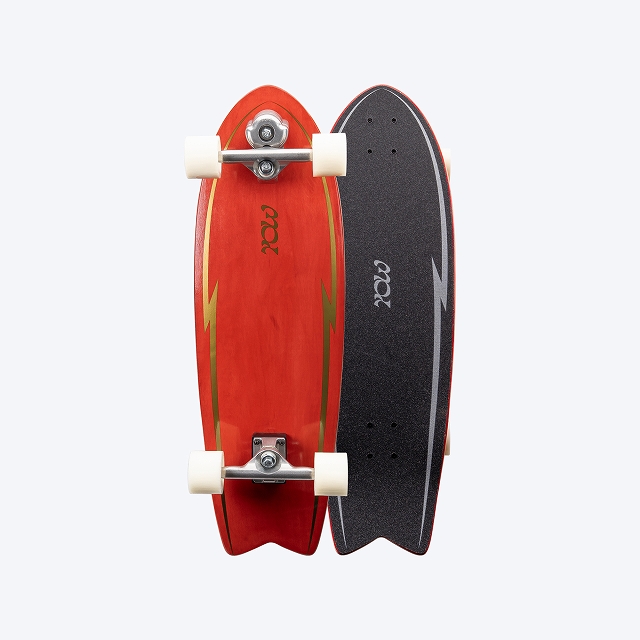 Two longboards stacked side by side, one red with white wheels and the other black with a textured grip against a light background.