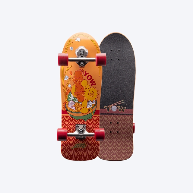 Two-sided skateboard: left half shows a bright orange deck with cartoon graphics and red wheels, right half features a brown patterned grip tape with red wheel edge.