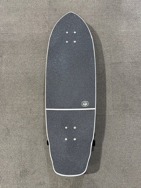 Top-down view of a two-piece skateboard deck with dark grip tape, white edging, on a concrete surface; small HP logo near the middle.