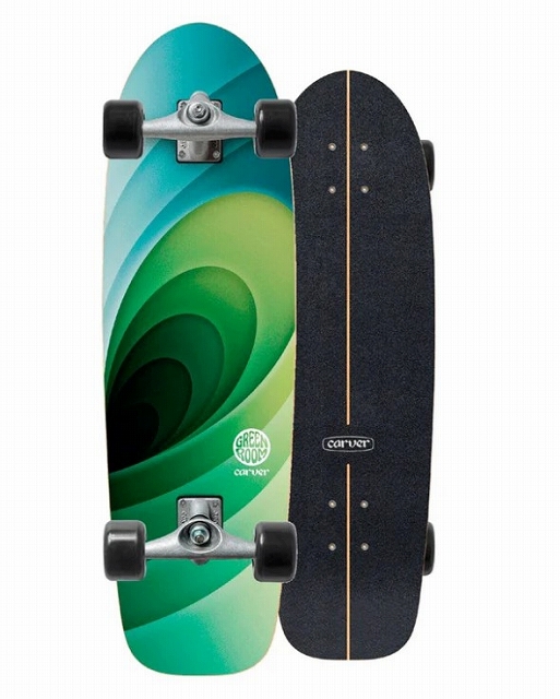 Two longboards side by side: left features a green–teal gradient with a swirl pattern; right is black with a tan center stripe and Carver logo.