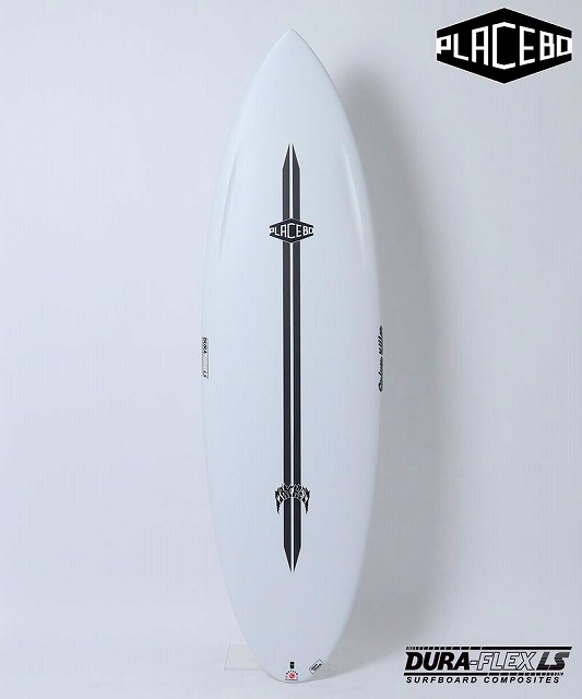 White surfboard standing upright against a pale wall with a central black double stripe and Placebo branding down the center.