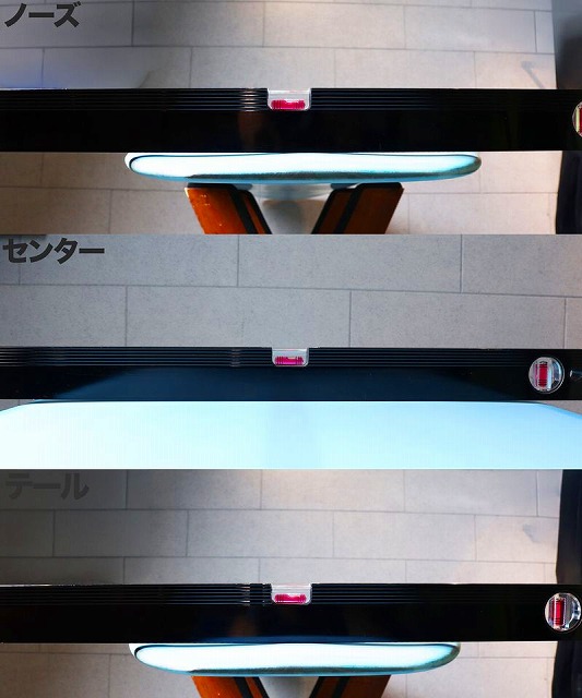 a-RuRZR6Tg - SHOP NEWS | ムラサキスポーツオンラインストア 通販 Overhead view of a modern circular glass table with orange legs, shown in multiple stacked angles against a tiled floor in a showroom.