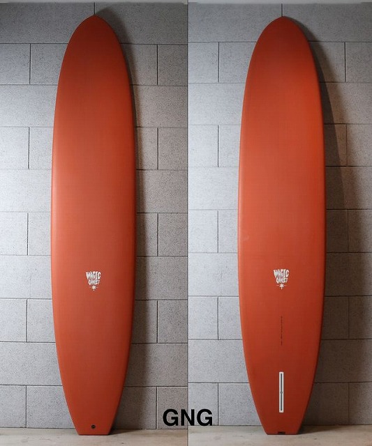 Two orange surfboards shown side by side against a gray tiled wall, displaying front and back views with a small white logo and 'GNG' at the bottom.