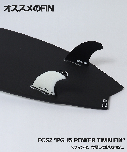 Black surfboard with two FCS2 fins (black and white) mounted, displaying the label PG JS POWER TWIN FIN on the fins and board edge.
