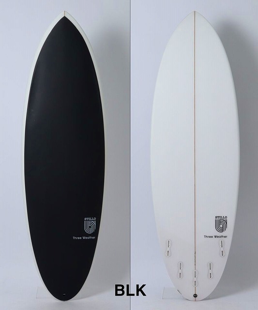 a-QamOPEew - SHOP NEWS | ムラサキスポーツオンラインストア 通販 Two surfboards standing upright side by side: left one is black, right one is white with a wooden center stringer; BLK label at the bottom.