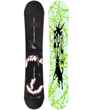Two snowboards standing upright side by side: left one dark with a menacing shark mouth graphic and a vertical logo; right one lime green with black abstract animal silhouettes and a splatter pattern.