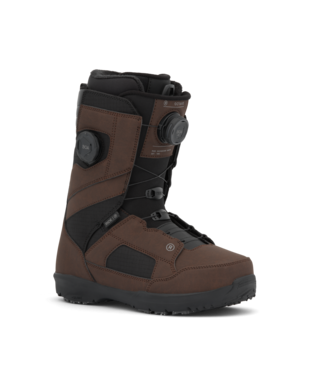 Brown and black snowboard/snow boot with two dial closures and side straps, shown from a slight angle.