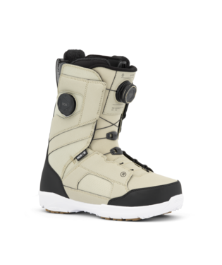 Beige snowboard boot with black toe cap and white sole, featuring two BOA dials and padded ankle support.
