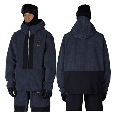 Front and back views of a navy corduroy parka with hood, chest zipper, and a black lower back panel, worn with gloves and a beanie.