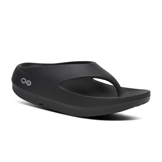 Black slip-on flip-flop sandal with a thick, curved sole and a toe post; logo visible on the side for casual wear