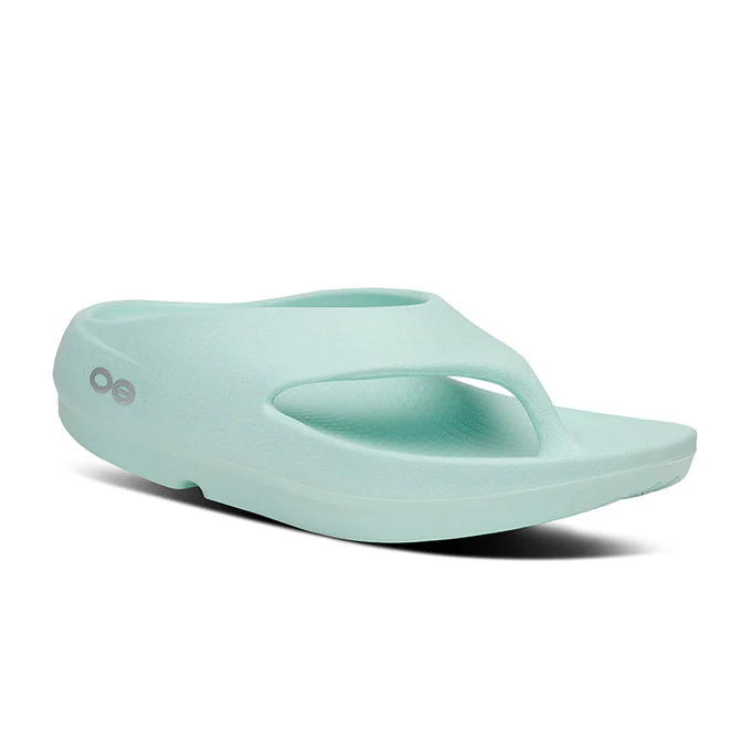 Light turquoise platform slide sandal with a wide toe strap and a small logo on the side.