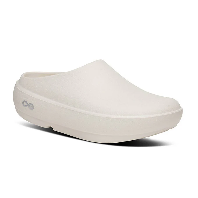 White slip-on clog with a thick platform sole and closed toe, designed for comfort.