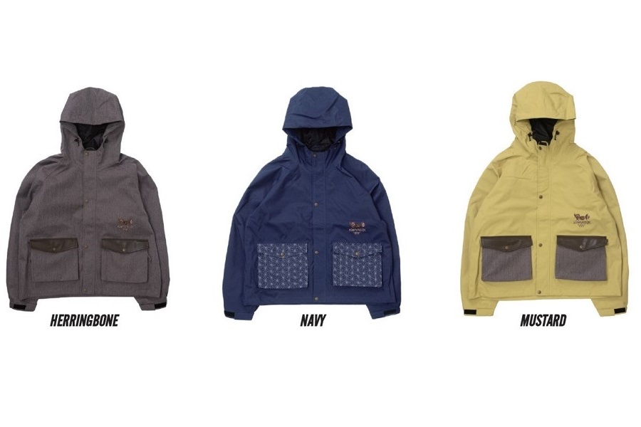 Gray hooded jacket with two large front pockets and black cuffs, labeled Herringbone