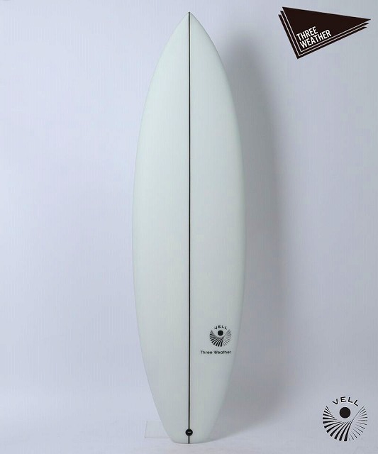 VELL1jpg - SHOP NEWS | ムラサキスポーツオンラインストア 通販 White glossy surfboard with a single black center stringer, standing upright against a light background; branding near the tail reads 'Three Weather'.
