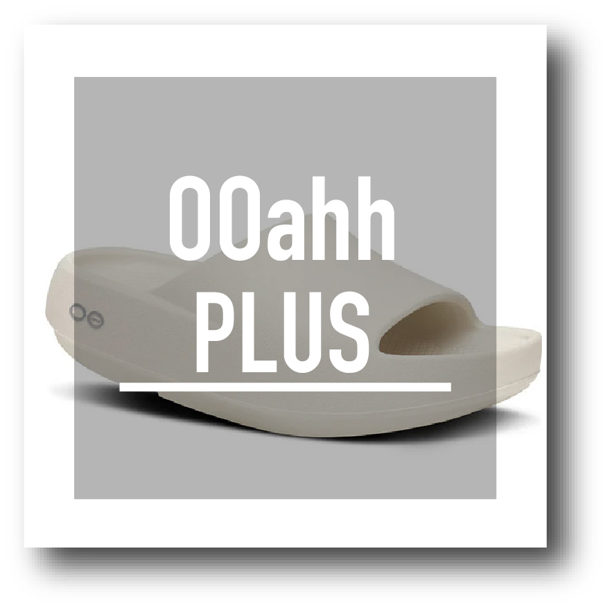 Beige slide sandal on a gray square with white'00ahh PLUS' text overlay.