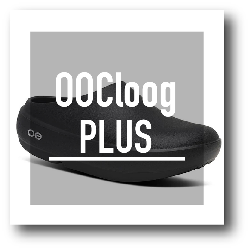 Black slip-on clog on a gray square backdrop with white 'PLUS' text overlay, a product image feel.