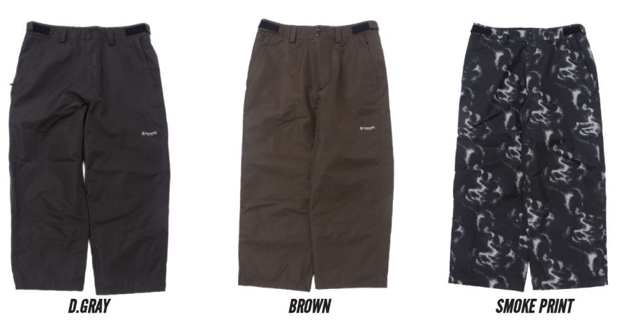 Three knee-length outdoor shorts in dark gray, brown, and black smoke‑print camouflage, each with belt loops, zip fly, side pockets, and a small brand logo on the left thigh.