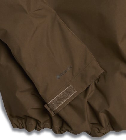 Close-up of a brown jacket sleeve cuff with a Velcro strap and elastic hem for adjustable fit.