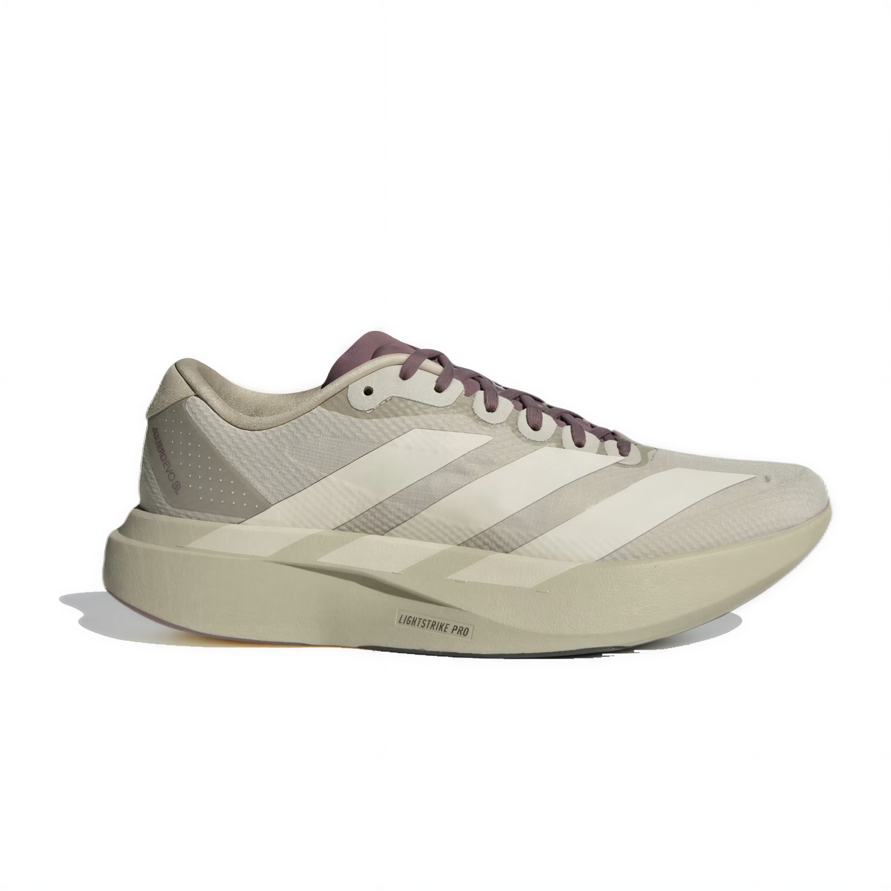 Beige running shoe side view with three white stripes and chunky light beige sole,'Lightstrike Pro' label visible near the midsole.
