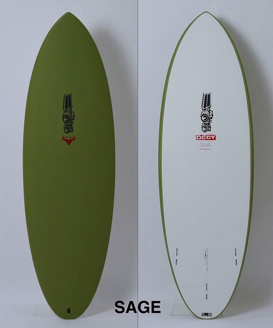 Two surfboards standing upright against a light wall: an olive-green board on the left and a white board with a green edge on the right, both with decals/logos.