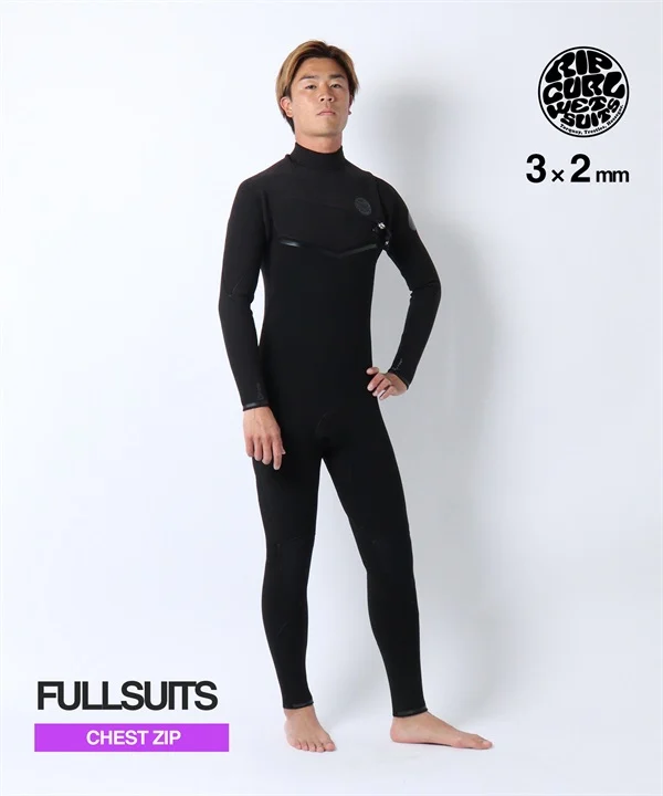 Male model wearing a black full-length wetsuit with chest zip, 3x2 mm thickness, standing with hands on hips.