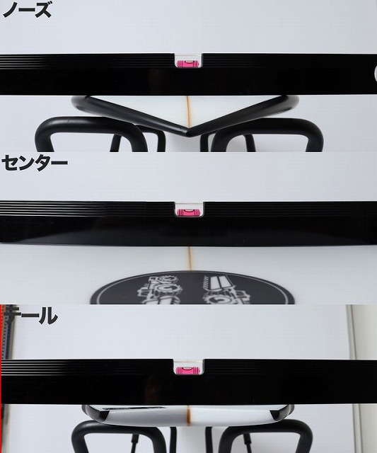 Close-up of a snowboard showing nose, center, and tail sections labeled in Japanese, with bindings and a graphic in the middle.