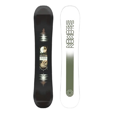 Two snowboards standing upright: a black board with circular graphic panels and reflections, and a white board with a vertical olive gradient and geometric logo.
