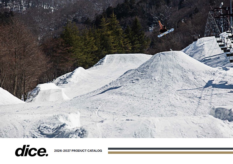 Snowboarder in mid-air over a snow ramp on a winter park, trees in the background; Dice 2026–2027 product catalog cover.